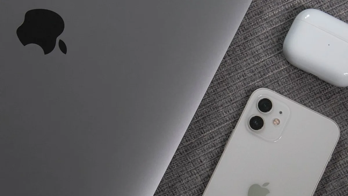 white apple remote beside white remote control