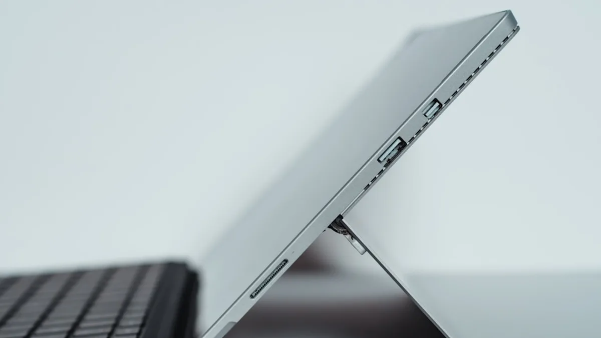 black laptop computer on white table