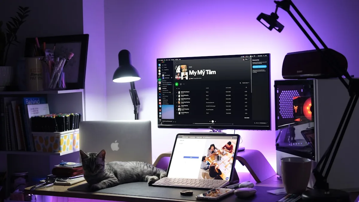 black and silver laptop computer on brown wooden table