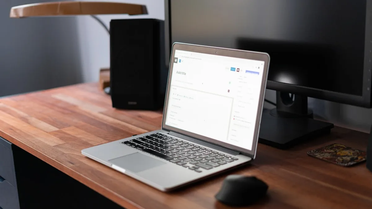 macbook pro on brown wooden table