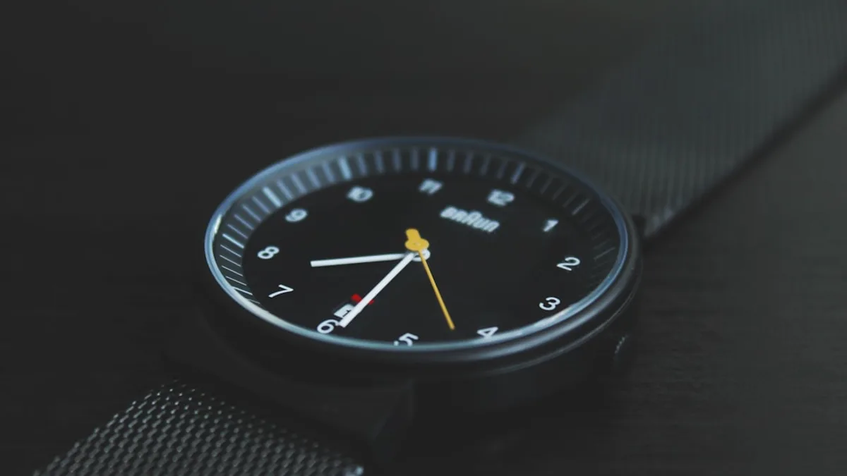 round black Braun analog watch with black band at 7:30