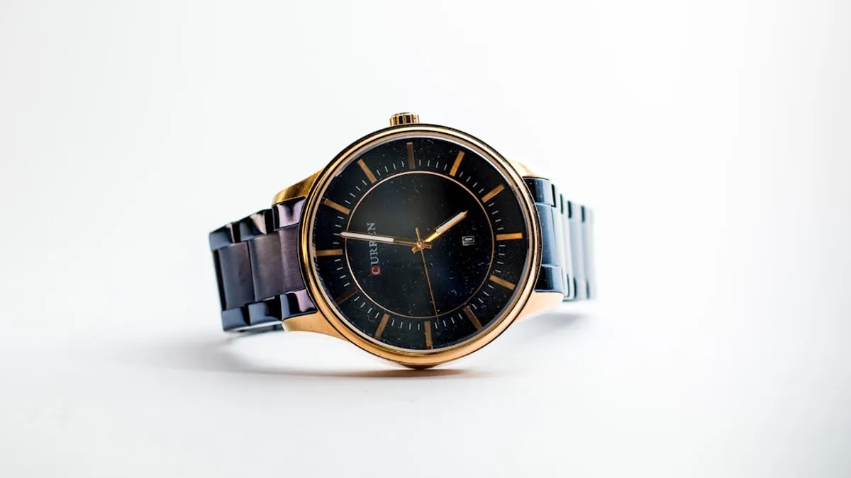 silver and gold round analog watch