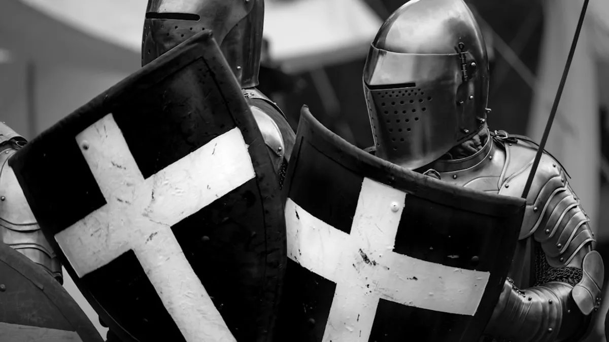 a man dressed in armor holding a sword and shield