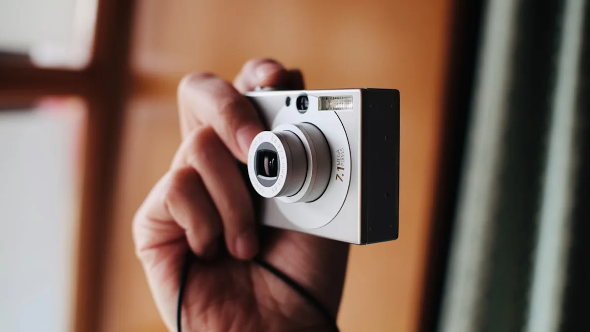 a person holding a camera in their hand