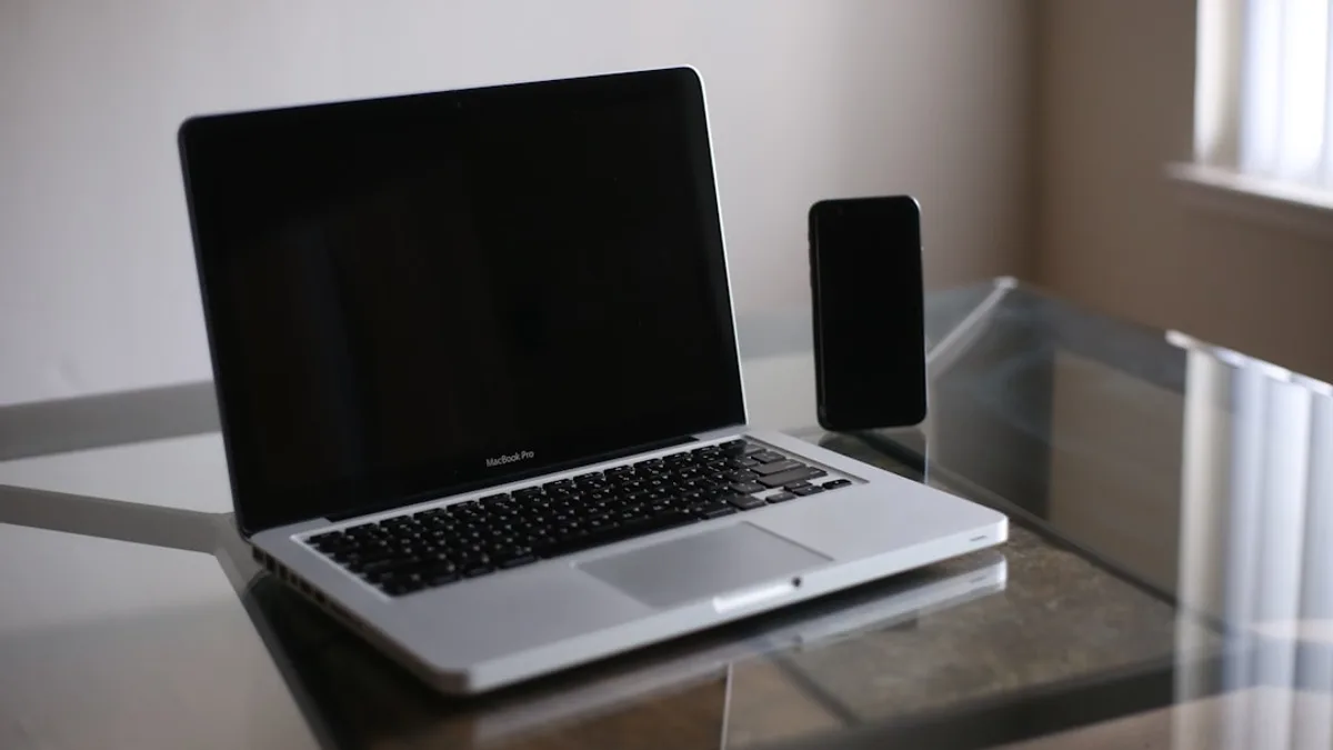 macbook pro on glass table