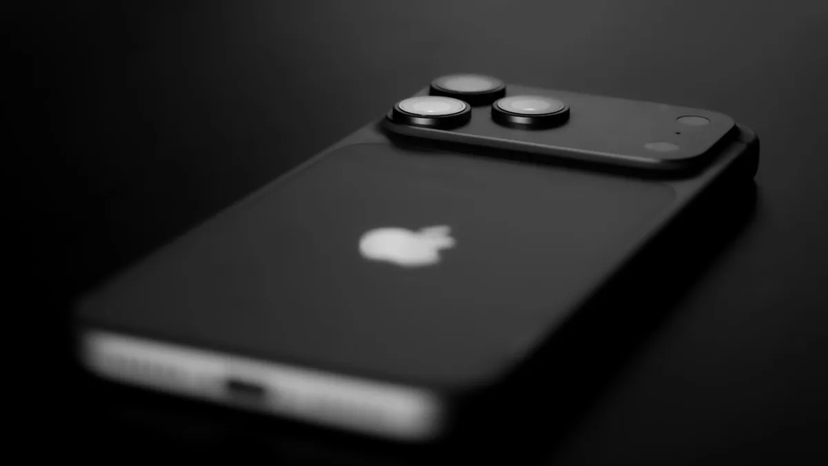 Black smartphone with three camera lenses on back
