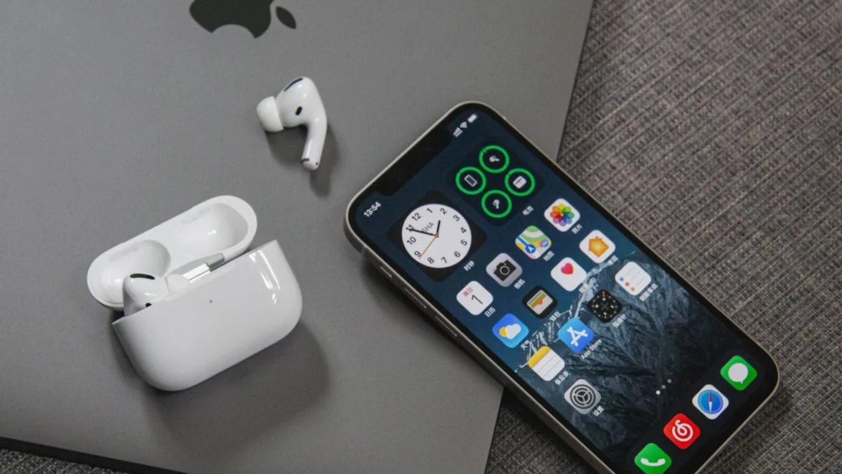 space gray iphone 6 beside apple earpods