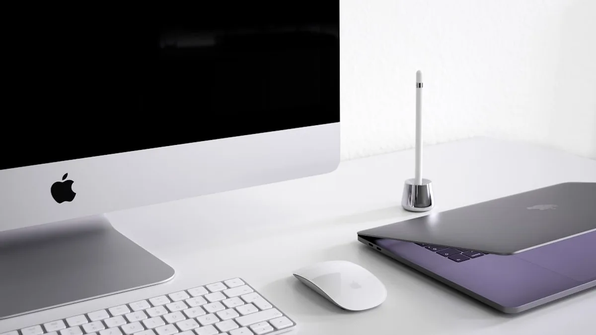 silver iMac, keyboard, and mouse