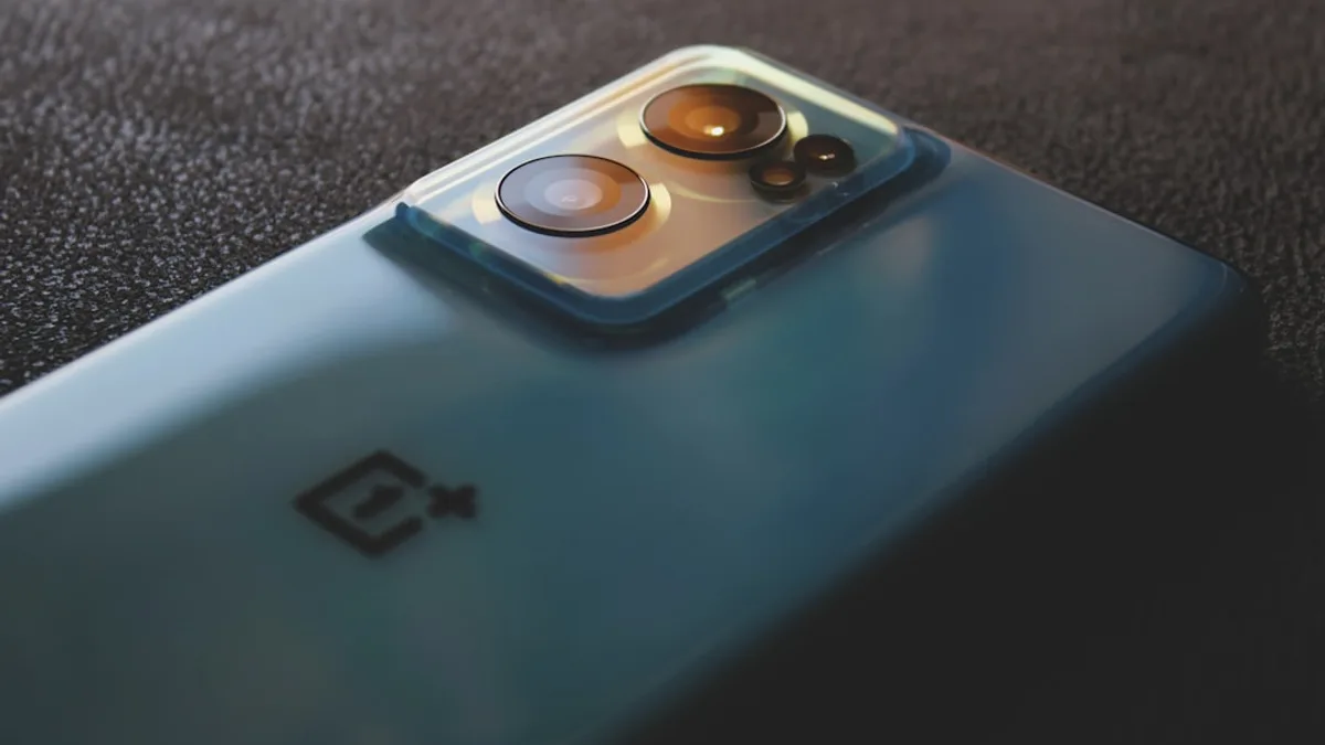 a close up of a cell phone with two buttons