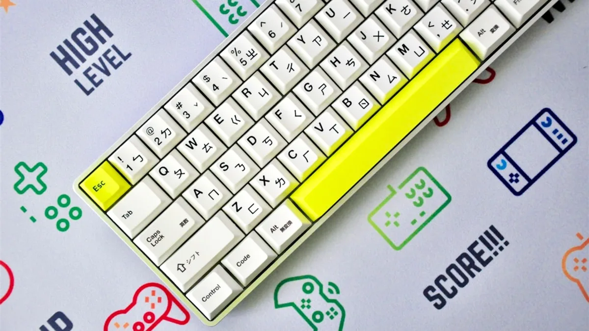 yellow and white keyboard on blue and white surface