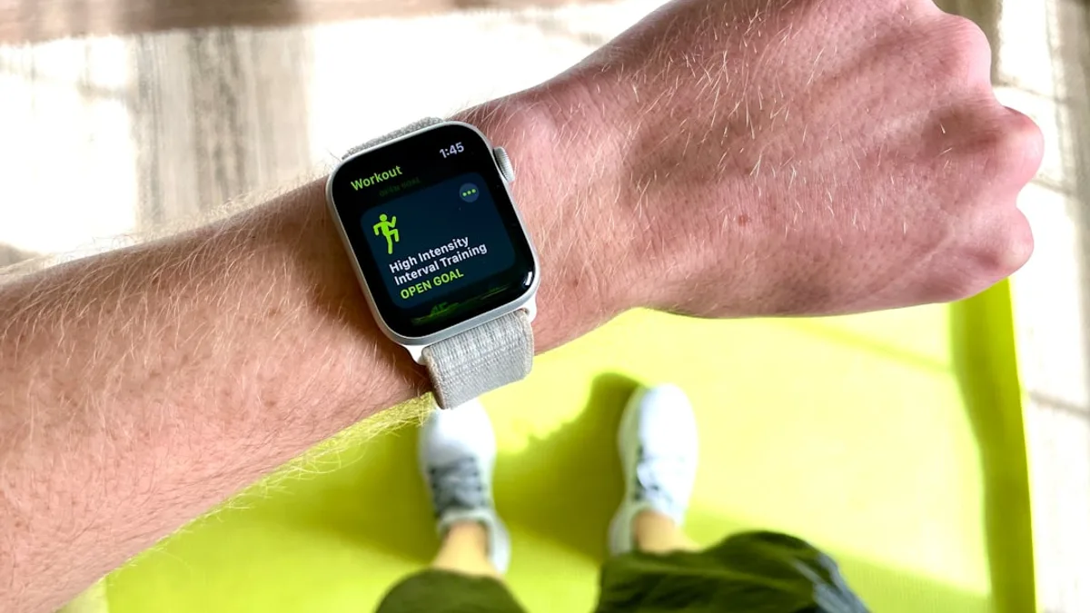 silver aluminum case apple watch with white sport band