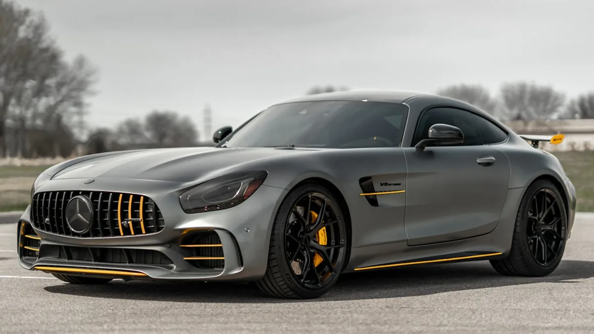 black mercedes benz coupe on gray asphalt road