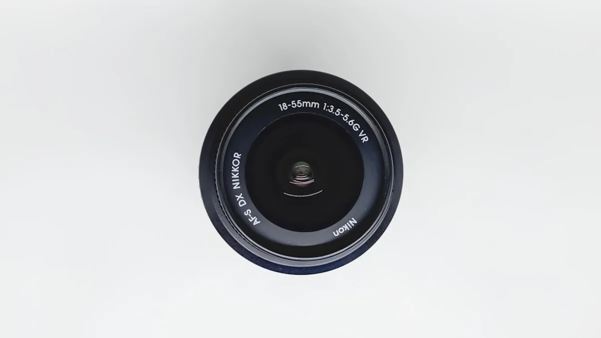 black camera lens on white surface