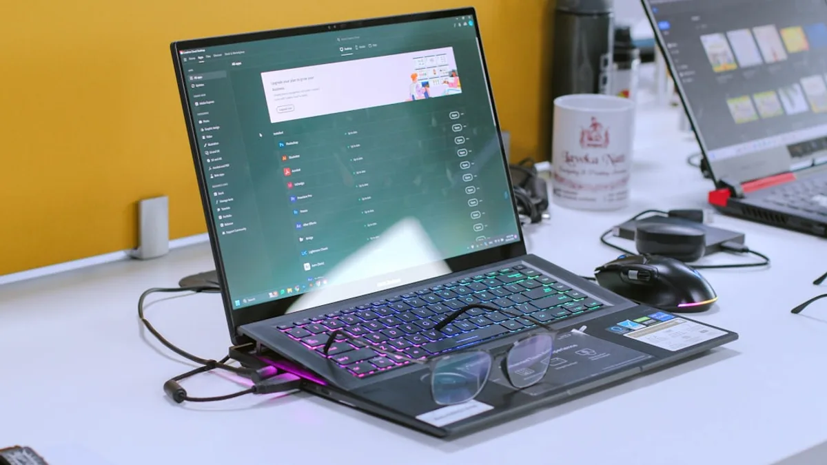 a laptop computer sitting on top of a white desk