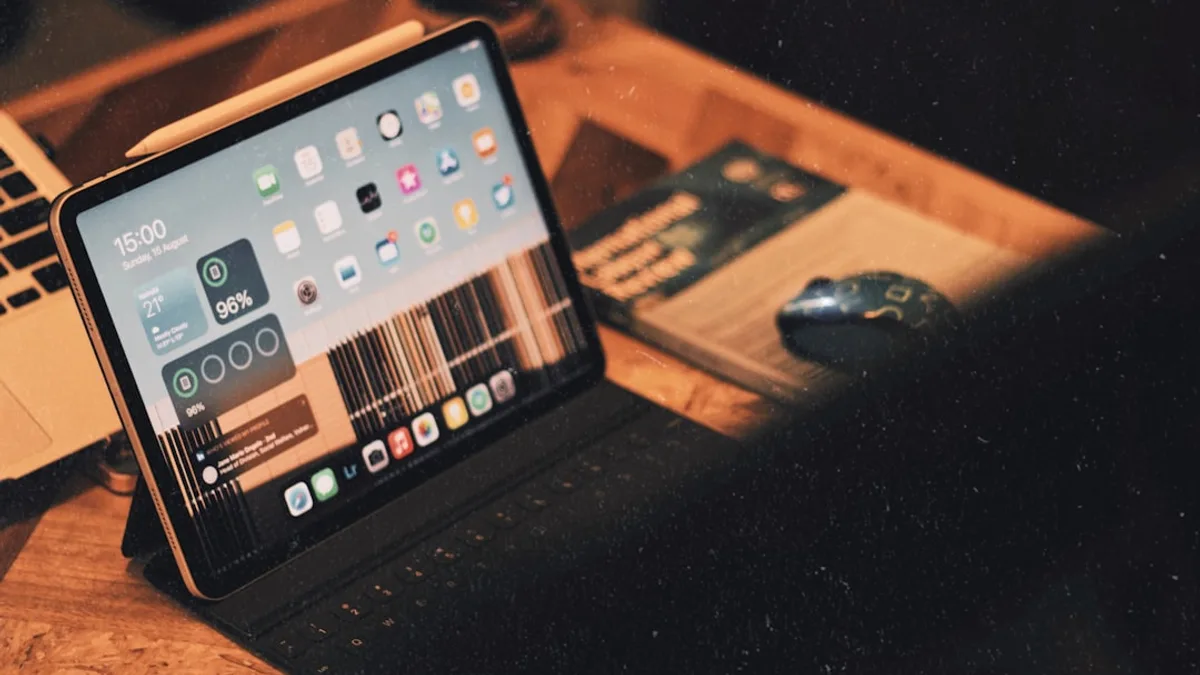 a laptop computer sitting on top of a wooden desk