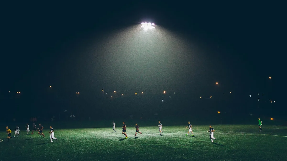 group of people playing soccer on soccer field