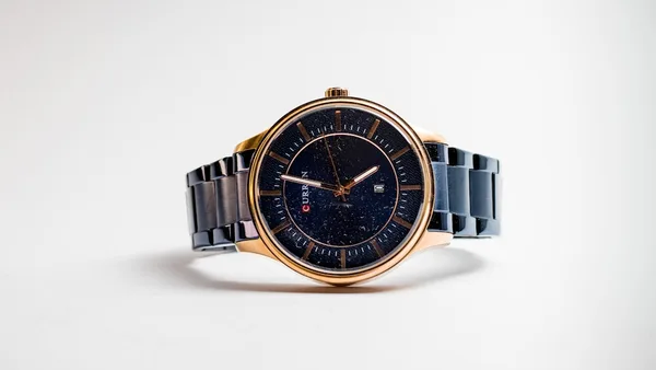 silver and gold round analog watch