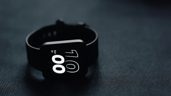 a close up of a watch on a table