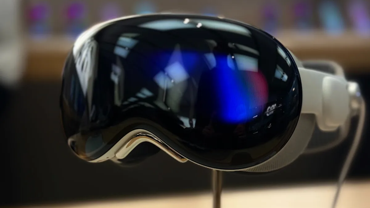 A pair of ski goggles sitting on top of a wooden table