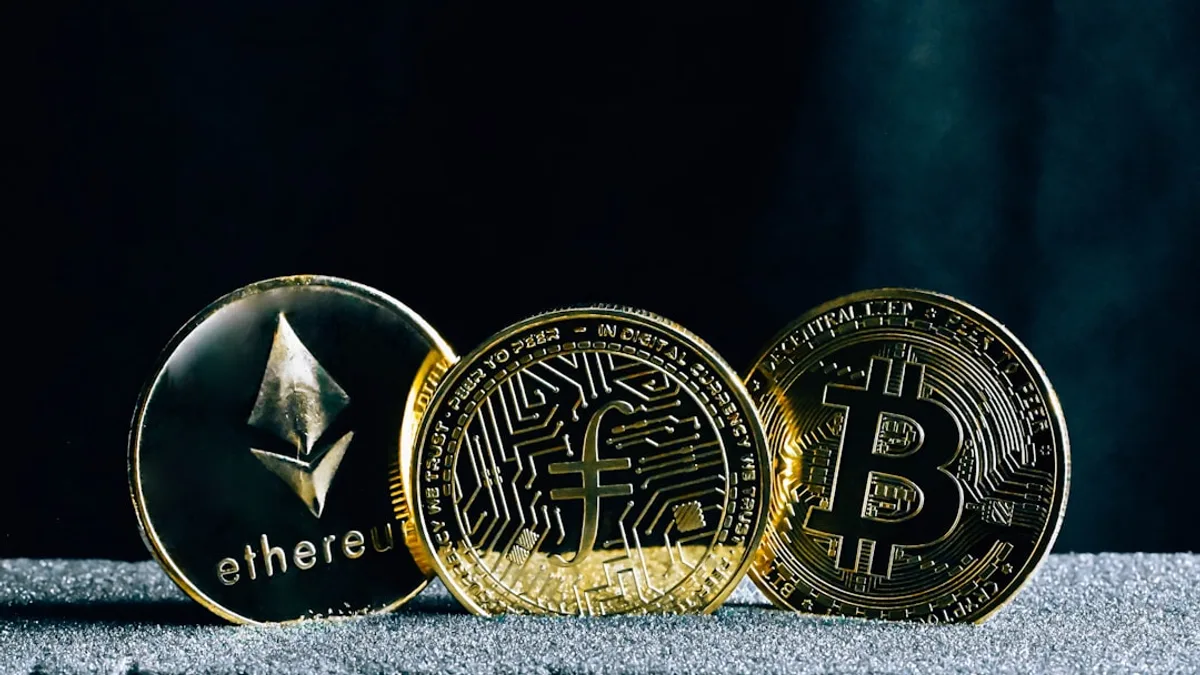 three bitcoins sitting on top of a table