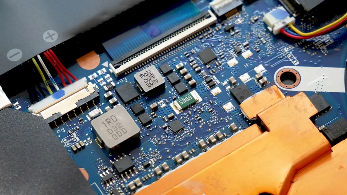 a close up of a motherboard with wires and wires attached to it