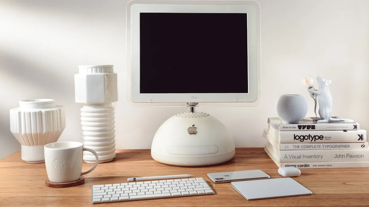 silver imac on brown wooden desk