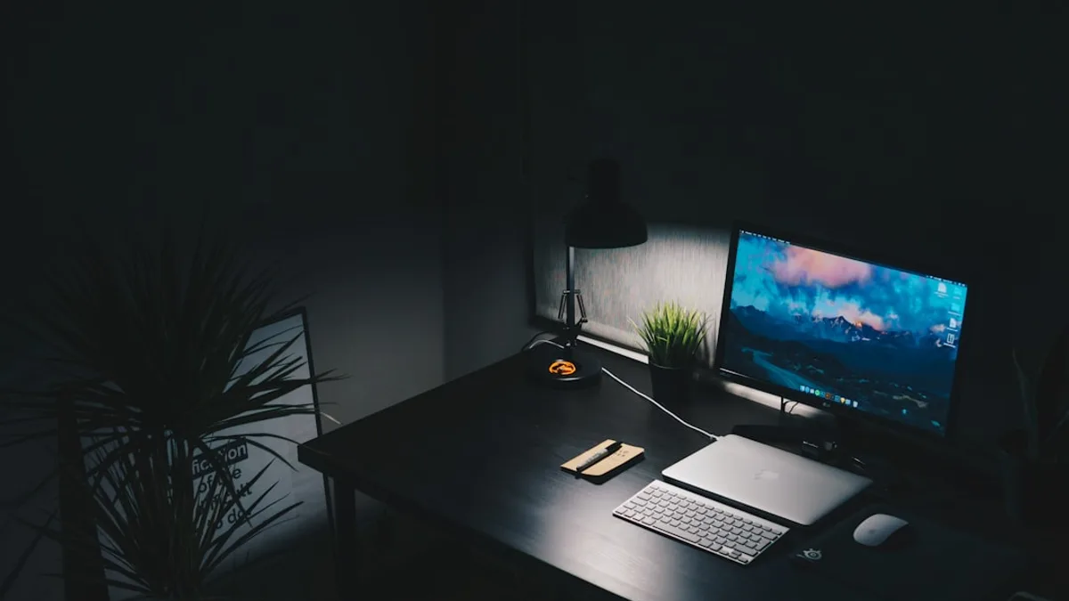 a desk with a computer monitor and keyboard on it