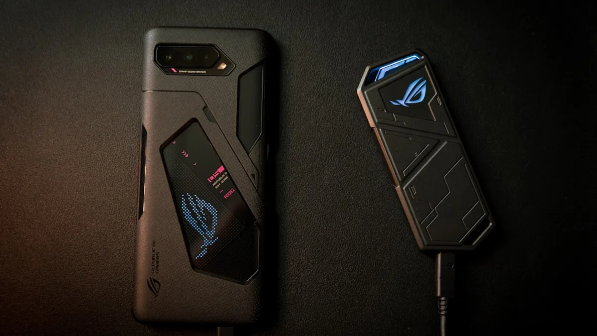 black smartphone on black textile