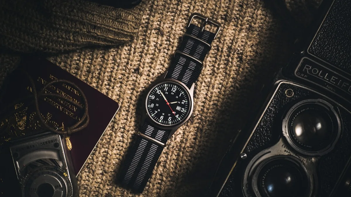 analog watch on brown textile