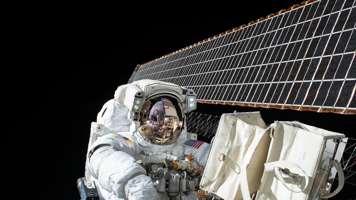 photography of Astronaut beside satellite