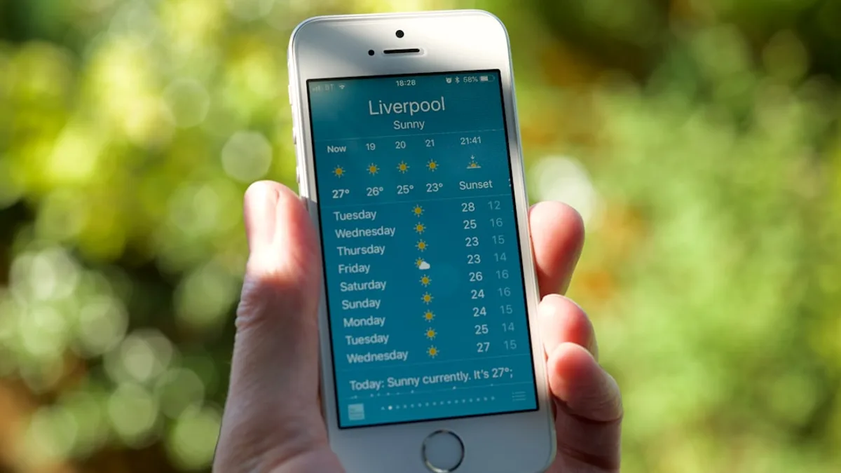 person holding turned on silver iPhone 5s displaying liverpool