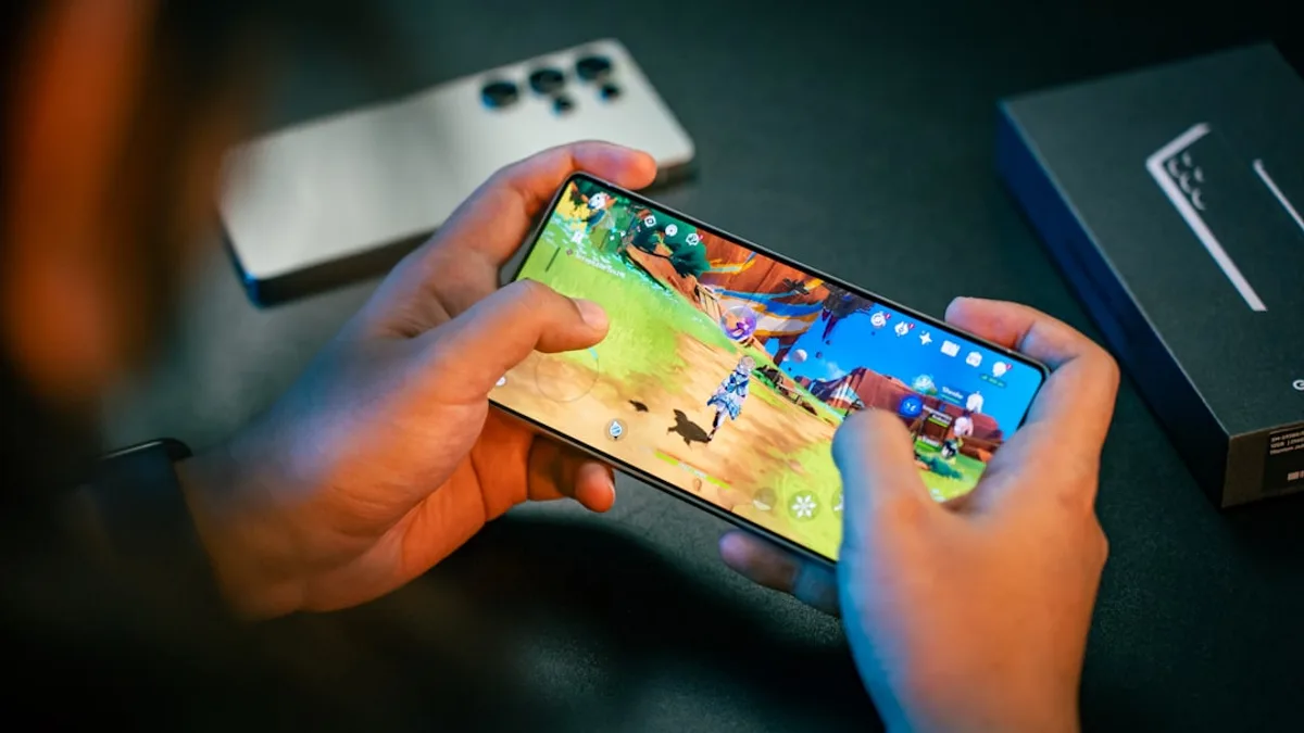 A person is playing a game on their phone