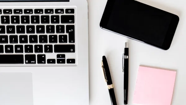 two pens near MacBook Air